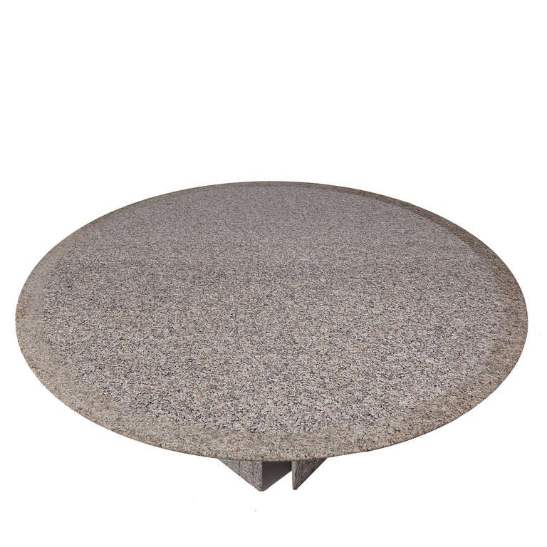 Hard to find table, made by Knoll in short production. Solid Sardinian Beta granite, in grey with rose-white tracery. Top is smooth polished except for border and beveled edges which retain natural granite texture. Four triangular legs, rough finish.