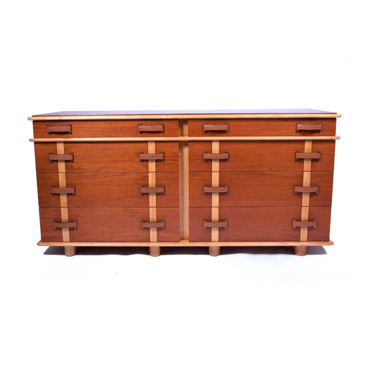Rare double chest of drawers, model 1041B-160, in the Station Wagon series, mahogany case and drawer fronts with birch detail and legs. Leather and brass drawer pulls. Marked in drawer, Johnson Furniture Co. Marked on back with model number.