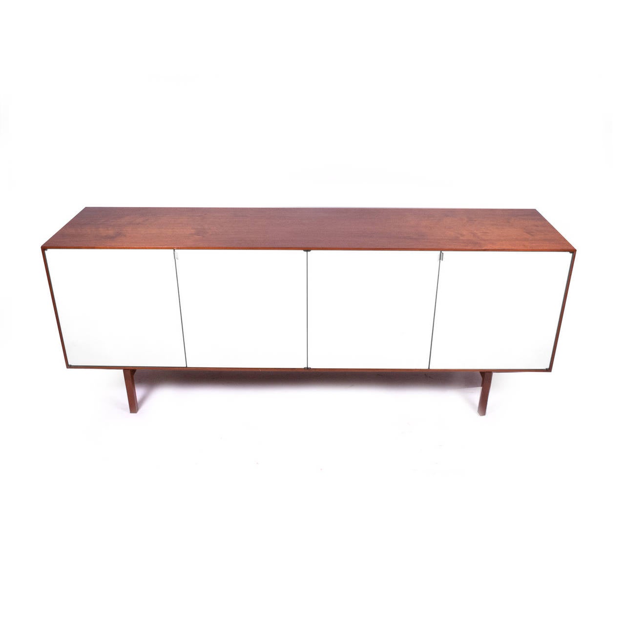 Teak cabinet with white lacquer doors interior with oak lacquer finish, two silver drawers four adjustable shelves. This credenza won the MOMA Good Design Award in 1950. Made by Knoll Associates.