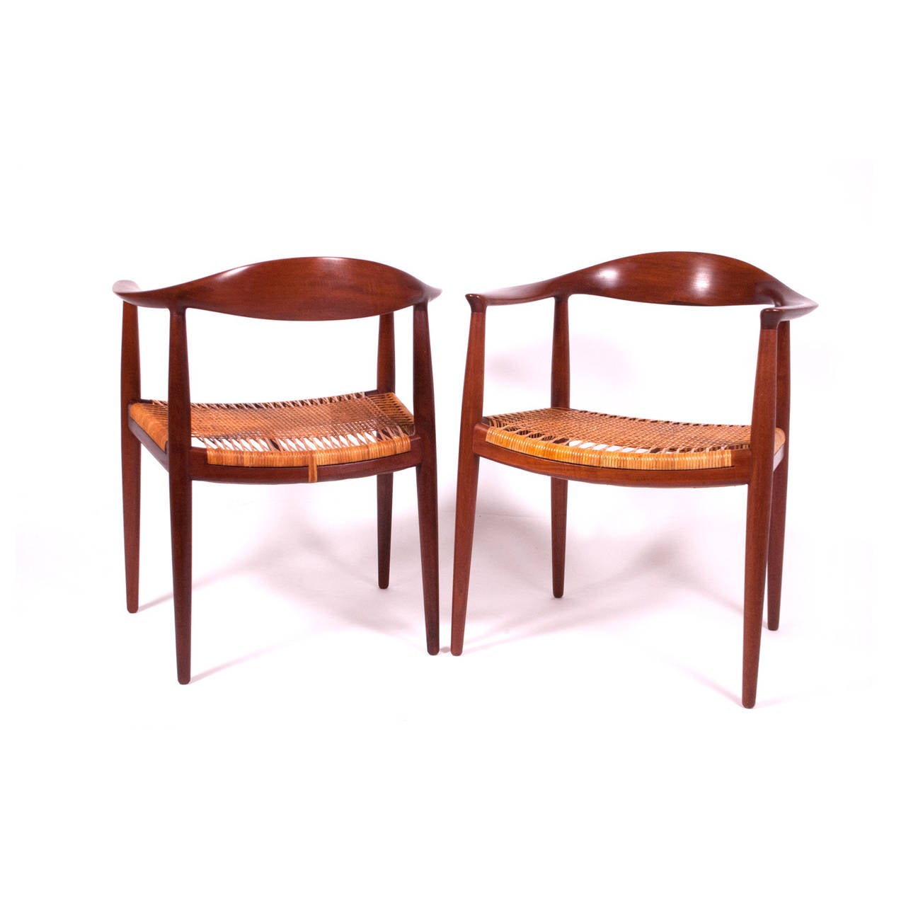 Solid teak and cane seat, pair of Classic chairs for Johannes Hansen.  Early production; signed on the stretchers.