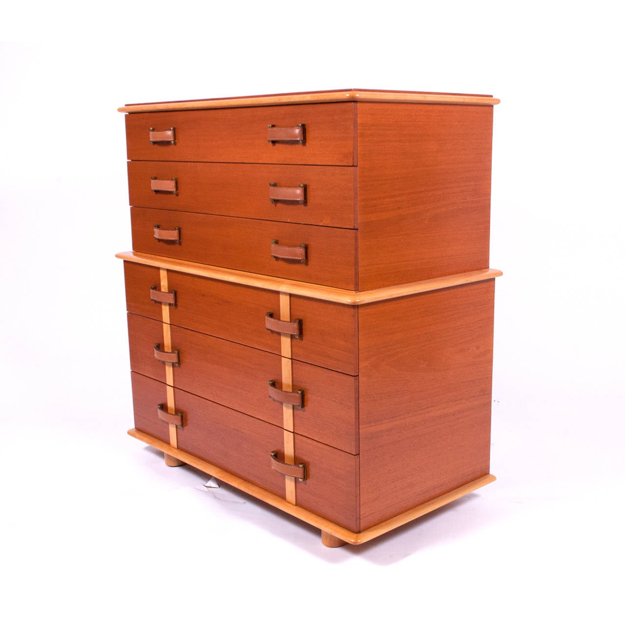 Rare high chest of drawers, in the Station Wagon series, mahogany case and drawer fronts with birch detail and legs. Leather and brass drawer pulls. Marked in drawer, Johnson Furniture Co. Marked on back with model number.