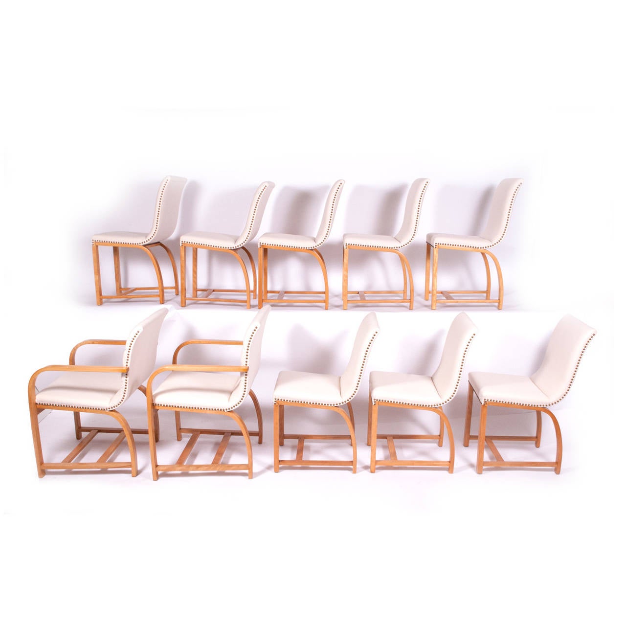 American Art deco set eight side chairs design by Gilbert Rohde Mfg.by H.Wakefield ,solid maple original paper labels to most of them.
No armchairs available; only side chairs.
