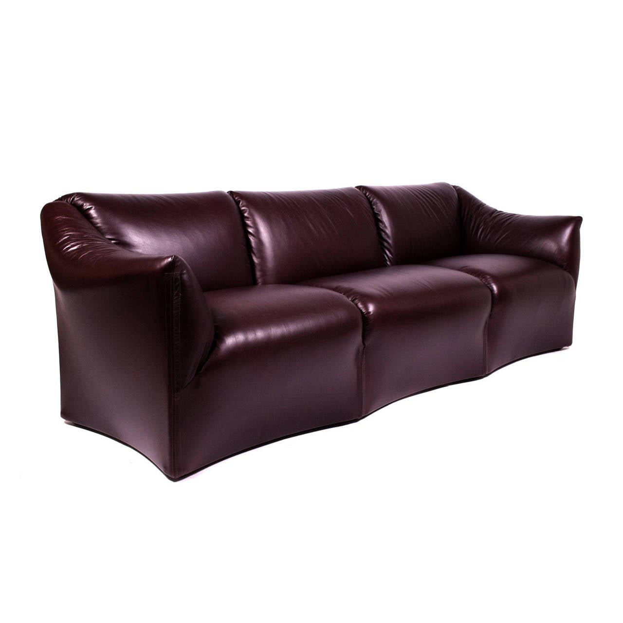 Three-seat sofa, newly covered in very dark wine colored leather, by B&B Italia; distributed by Atelier International.Cassina