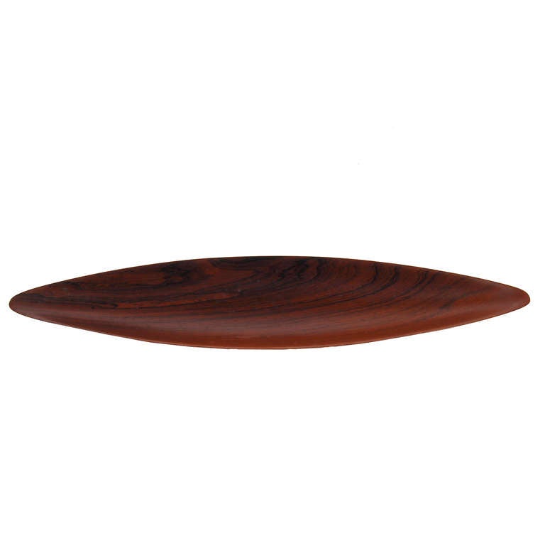 Beautiful and elegant handmade narrow leaf shape bowl in solid rosewood. Designed and carved by Johnny Mattson, Sweden.  Produced by AL-Bo, Denmark. Marked on base.