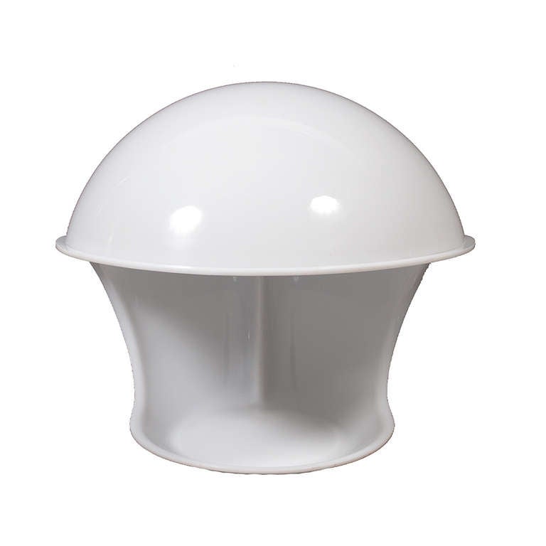 Molded white methacrylate table lamp in curved form, with electric cord fitting in groove along back.  Marked on bottom.  Made by Martinelli Luce.