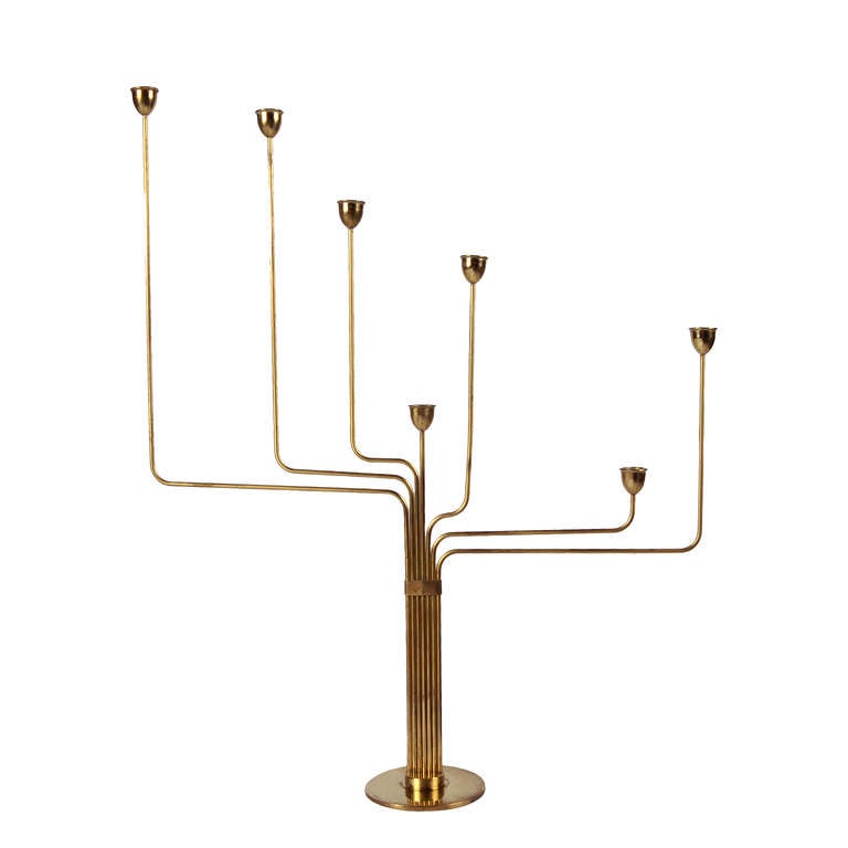 Solid brass candelabra, created by Hein while living in Argentina. He designed this to remind him of his home in Denmark, since the star constellation is not visible in the southern hemisphere. This is the first model designed of his candelabra; the