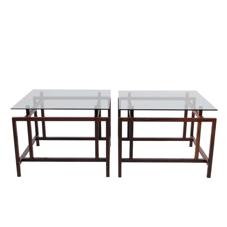 Pair of solid rosewood architectural base tables with floating smoked glass top.
Made by Komfort.