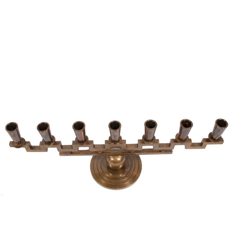 Solid brass Art Deco candelabra made by one of the founders of Arvika, an association of Swedish crafts people founded in 1922. Holmstrom's pieces, which are infrequently seen, were featured at the 1925 Paris Exposition. Signed.