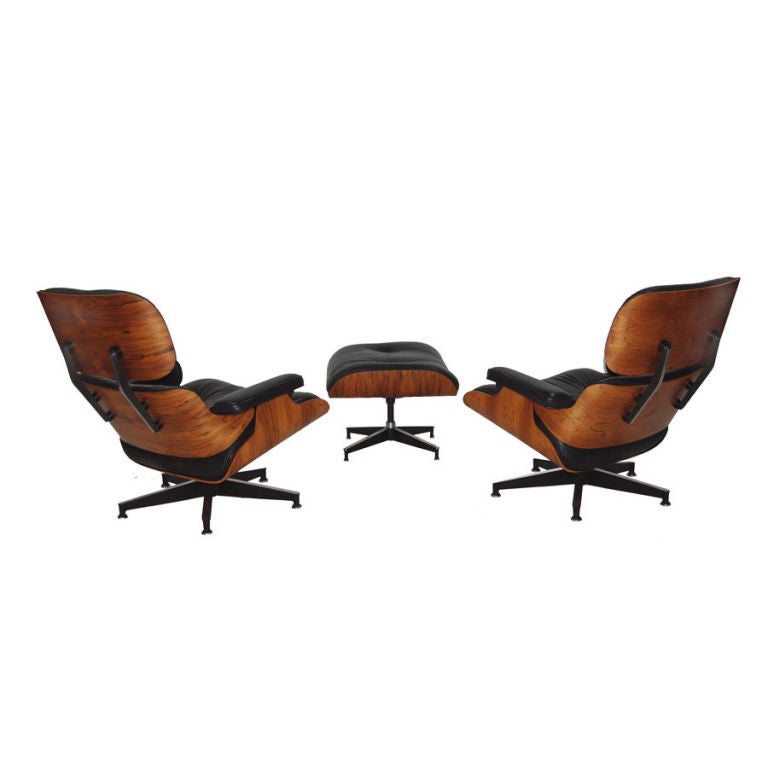 Pair of Charles Eames Rosewood Lounges and Ottoman
