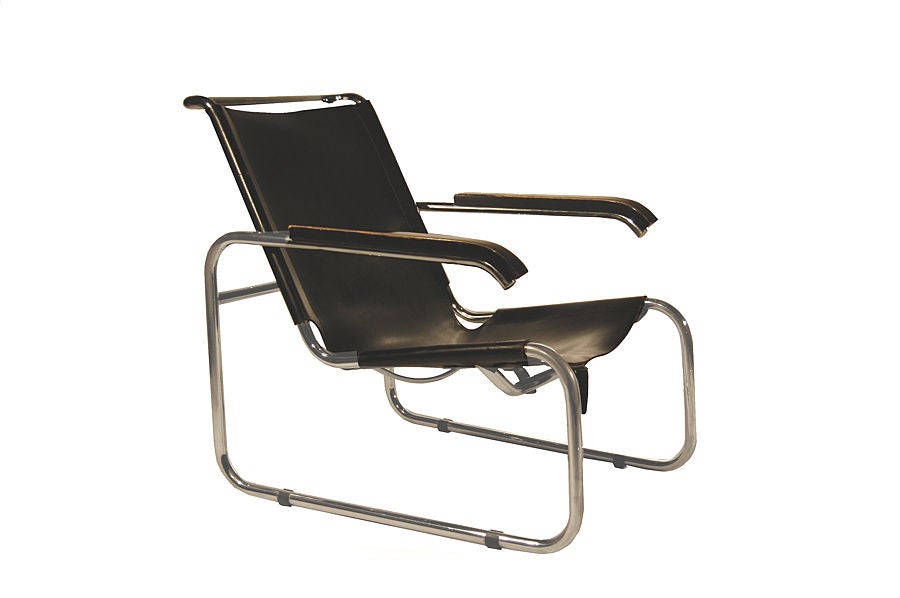 Classic Breuer design with tubular chrome frame, ebonised wood arm rests and black sling seat. Good original condition. These pieces made circa 1960. Made by Thonet. These pieces are reduced in price from $7000 pair to $4900 pair.