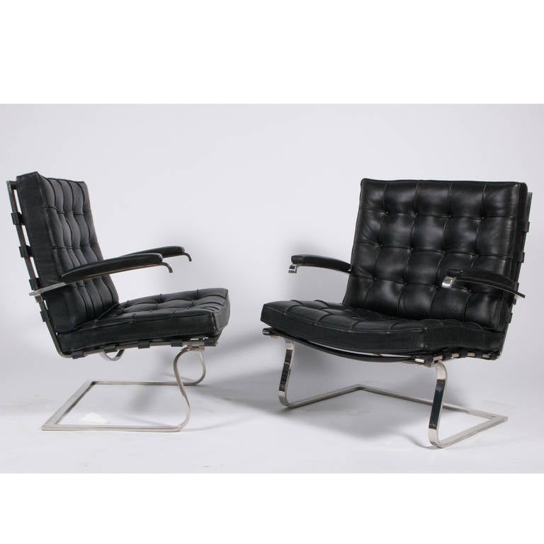 Designed for the Tugendhat House in Brno, Czechoslovakia in 1930. This pair, black leather on flat stainless steel frame with leather strap supports, was purchased in the late 1970s. Made by Knoll. Retains Knoll label.