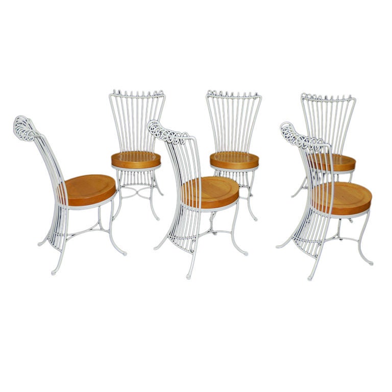 Beautifully designed set of white painted rod iron chairs. Solid 2" pine seats. Restored.
