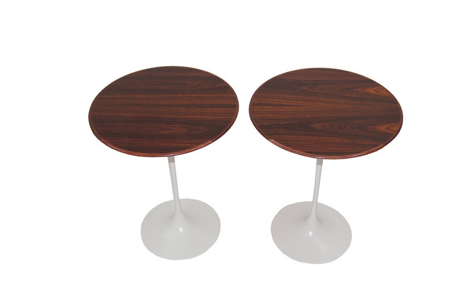 Iconic design, rosewood tops on white painted metal base.  Made by Knoll.
