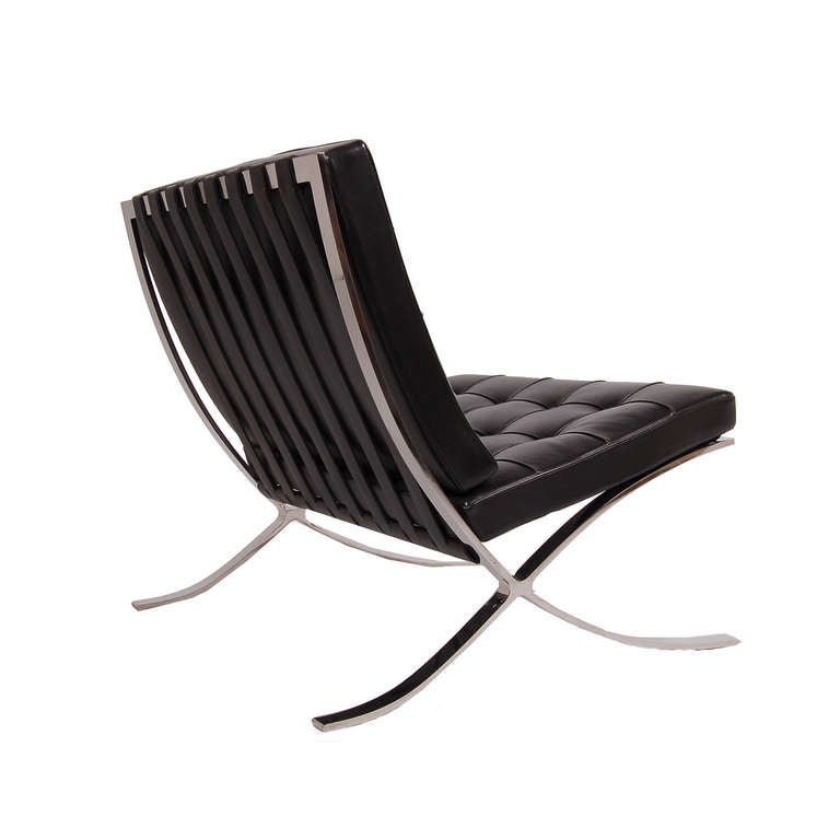 Iconic chair with stainless steel frame and tufted black leather back and seat.  Marked in decking, Knoll.