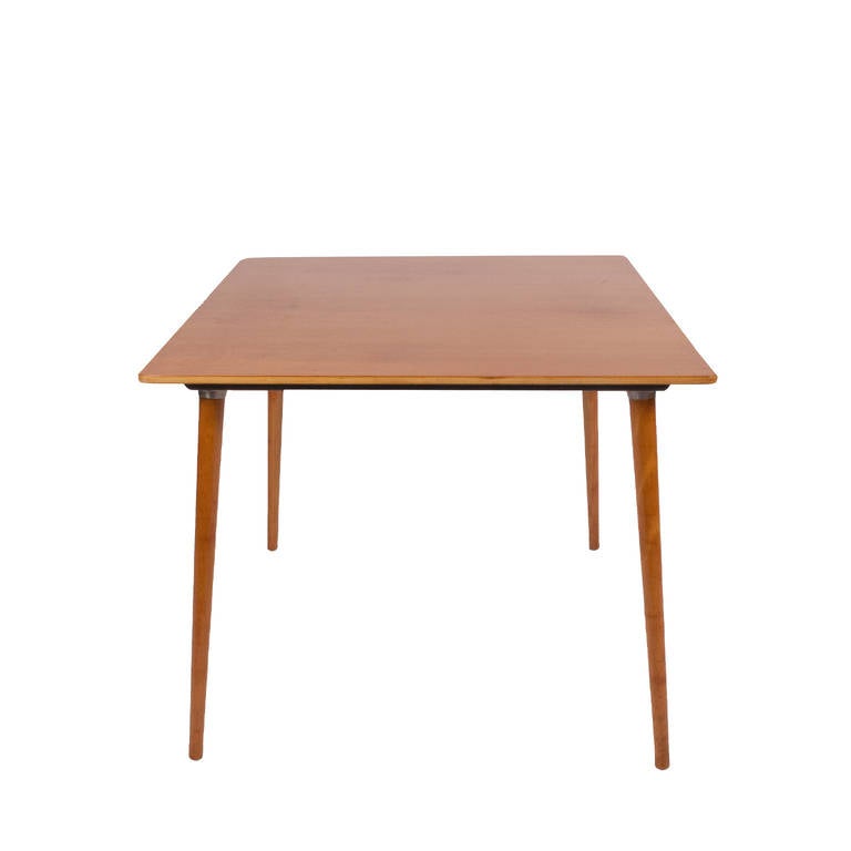 Hard to find square birch table with detachable solid dowel legs. 
Made by Herman Miller.