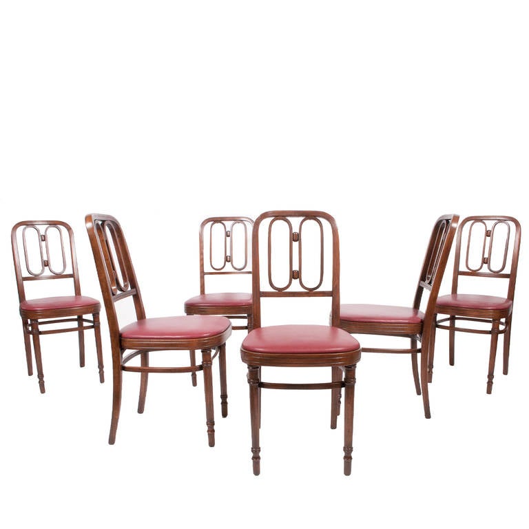 Set of six bentwood chairs, with decorative elements to back.  New leather upholstery.  Burn marked 
