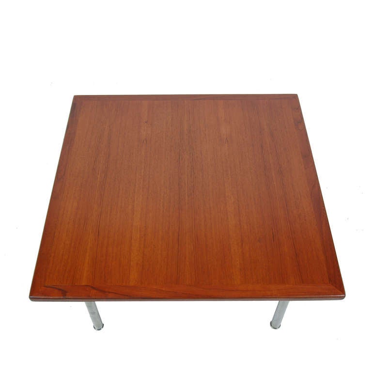 Square, teak coffee table with nickel plated steel legs. Made by Andreas Tuck.
