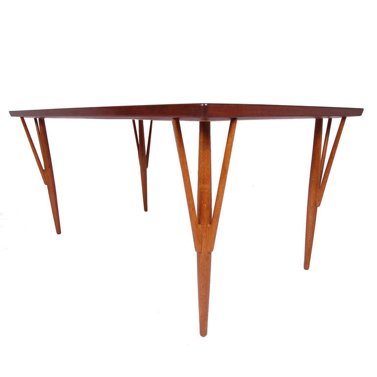  Rare dining table, teak top and solid oak three prong legs. Shown in Johannes Hansen's booth at the Cabinetmaker's Guild Exhibition in 1949. This table pictured in the book, 