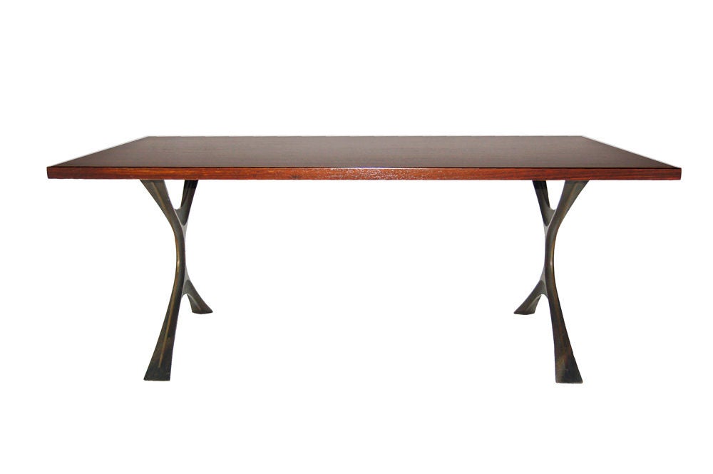 Very rare intermediate height coffee table, rarely seen. Rosewood top on two bronze curved x bases. Made by Herman Miller.