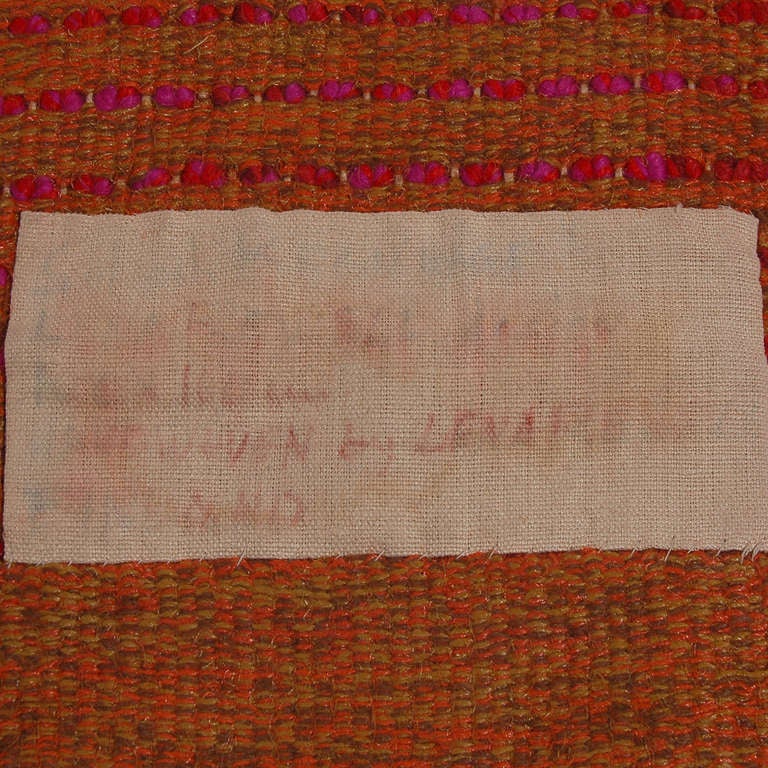 Colorful long pile wall hanging, handwoven wool. Retains label and hand written tag. Made by Lena Rewell Studio.