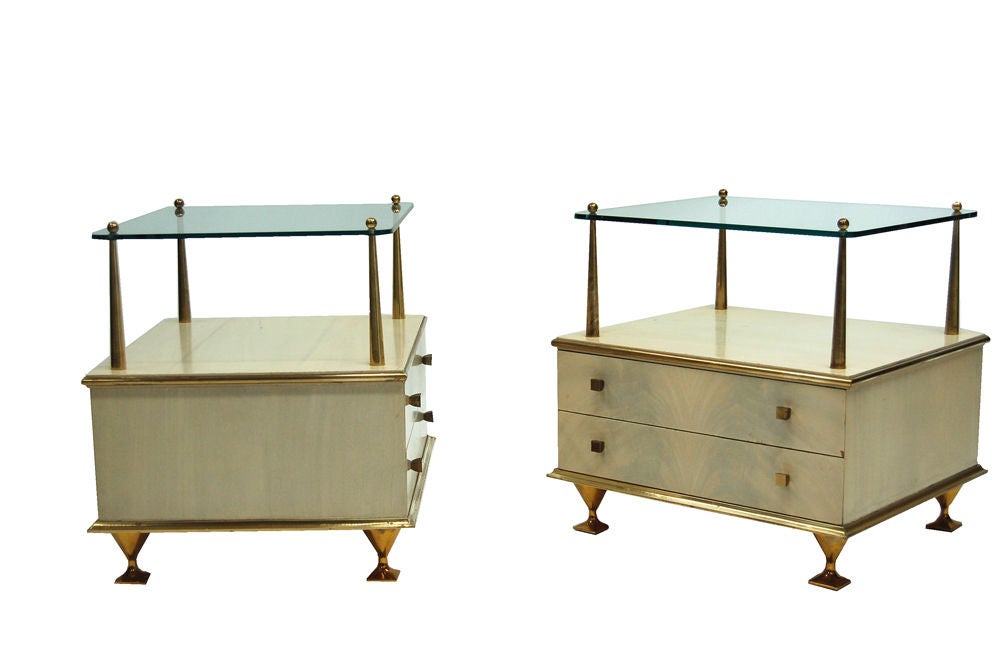 Nightstands with two drawers, brass posts hold 