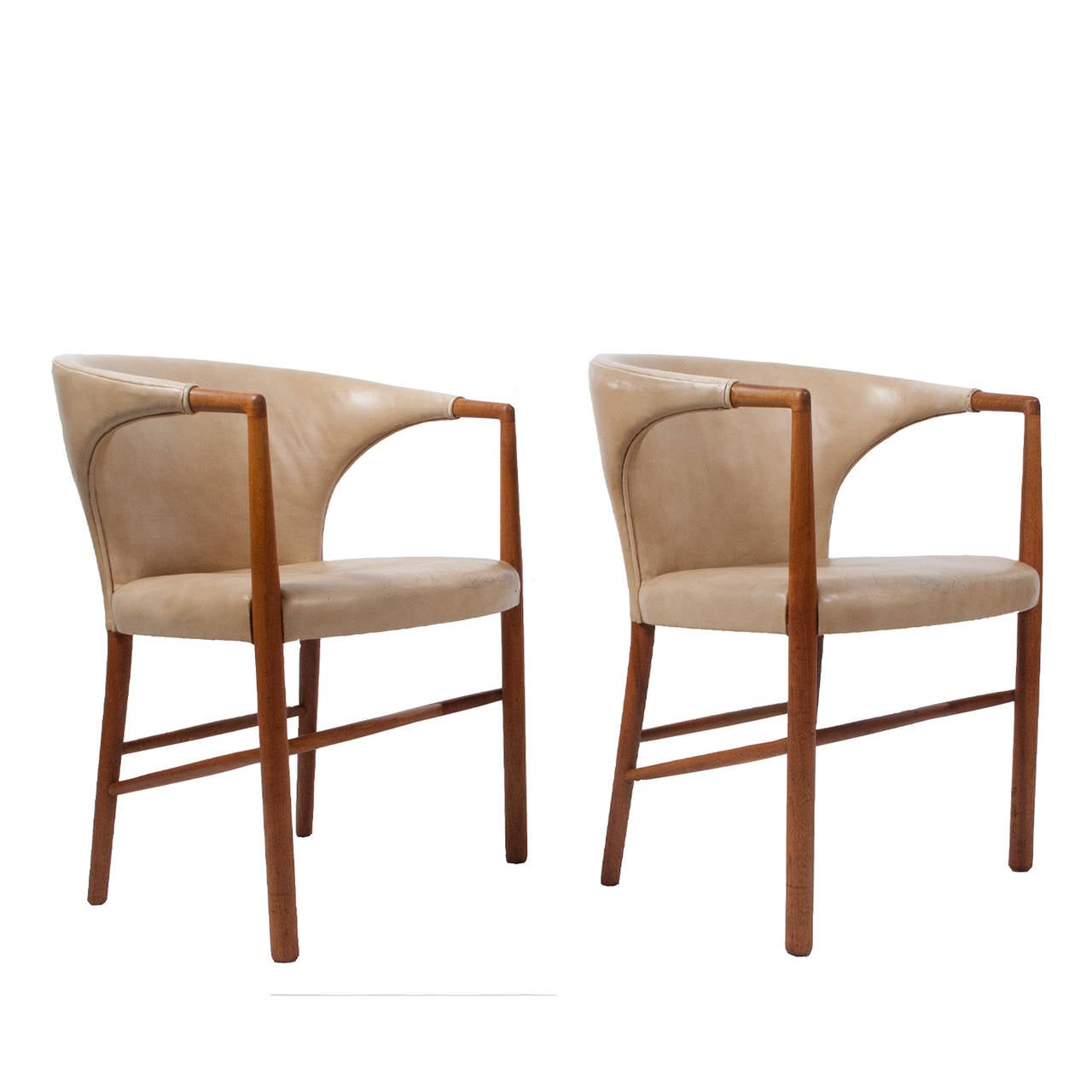 Original leather on African mahogany frame, these chairs are upholstered version of the chairs designed for the UN. Retains label, Jacob Kjaer Mobelhandvaerk, Udfort, 1954.