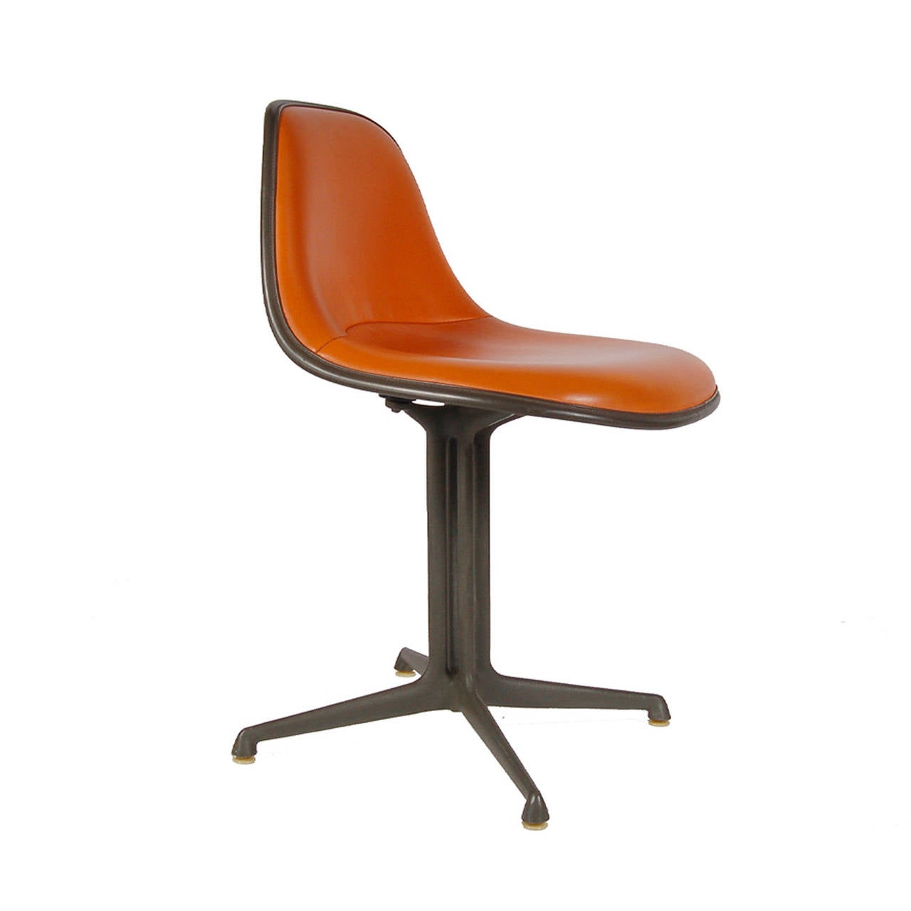 Armless version of the 1700 series, low back, vinyl upholstered fiberglass shell on dark gray powder coated cast aluminum base. Retains label to bottom and manufacturer's mark stamped in base. Made by Herman Miller.