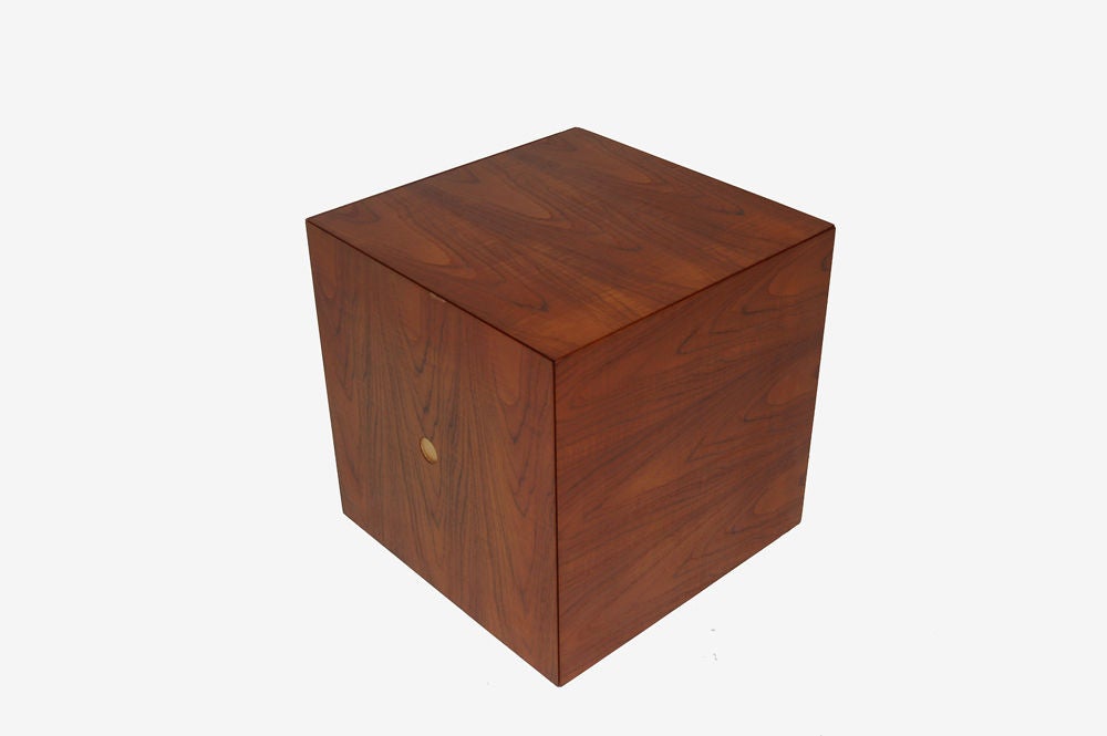 Teak cube, which opens to contain six occasional tables on chrome bases. Retains label.