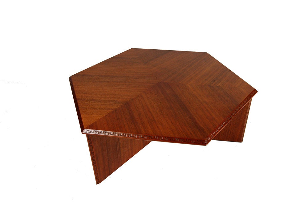 Mahogany six-sided coffee table with Taliesen design edge. FLW stamp. Price reduced from $6500.