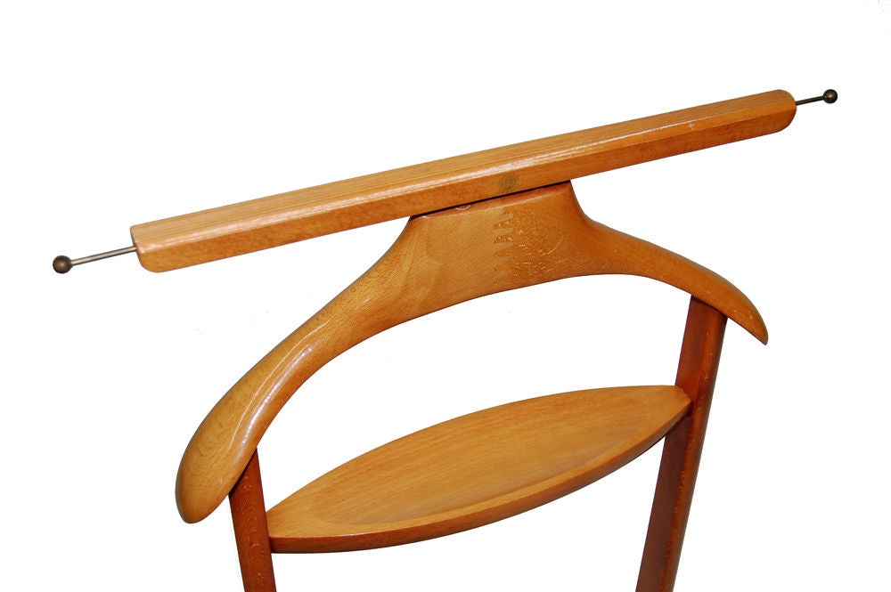 Men's valet in beechwood with brass pull out rods for tie hanging. Small tray for pocket contents; on casters. Marked with company logo FR. Made by Fratelli Reguitti. PRICE REDUCED from $950 to $475.