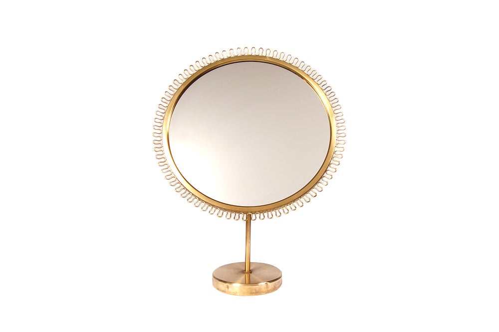 Brass and mahogany adjustable tilt mirror. Made by Svenskt Tenn