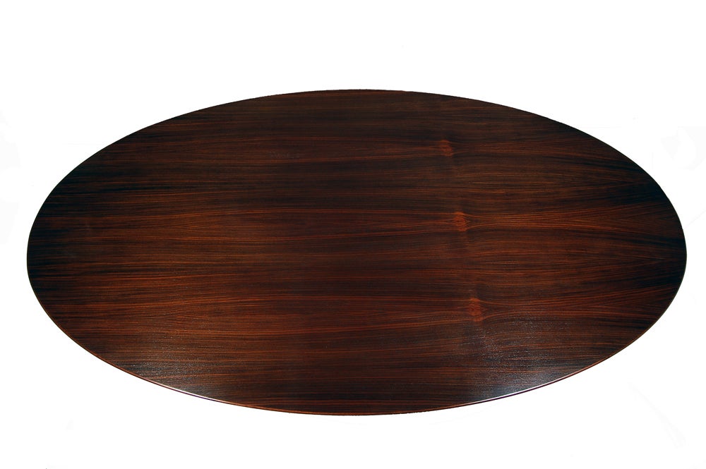 Largest size oval top in rosewood with white painted pedestal base.  The older large ovals do not come around too often, especially in rosewood.  Restored top and base. Made by Knoll Associates. This table has been reduced in price from $9600 to