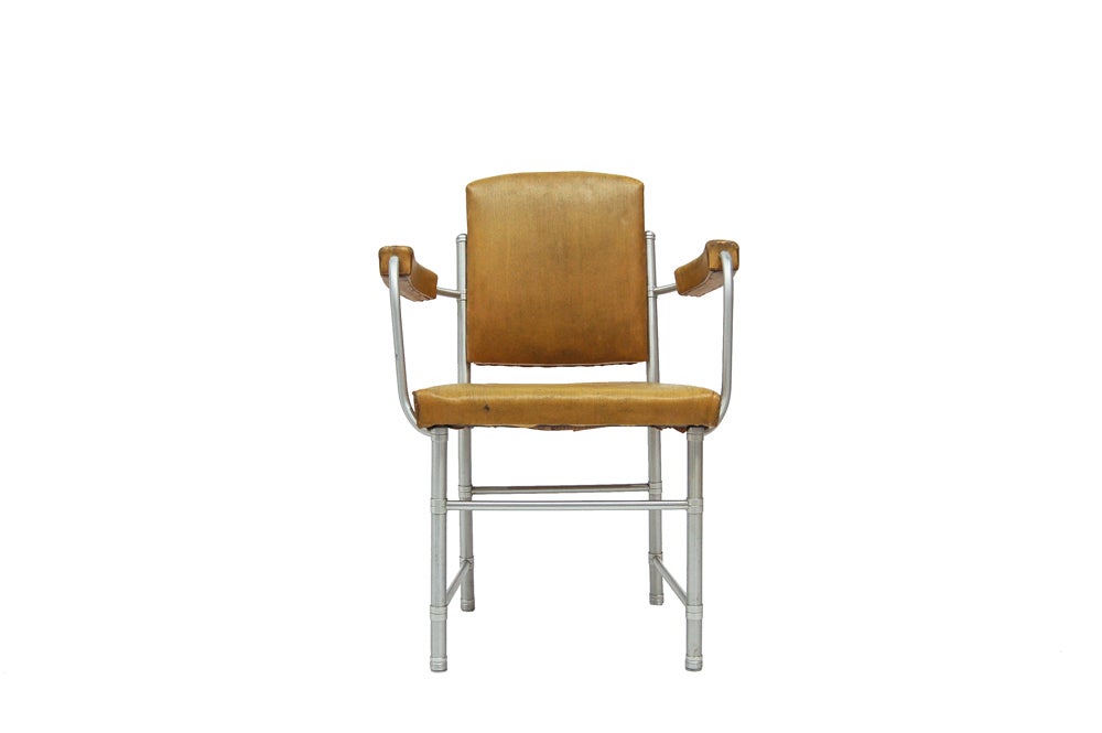 Anodized aluminium frame with original yellow oilcloth upholstery. Made by Warren McArthur Corporation, NYC.
