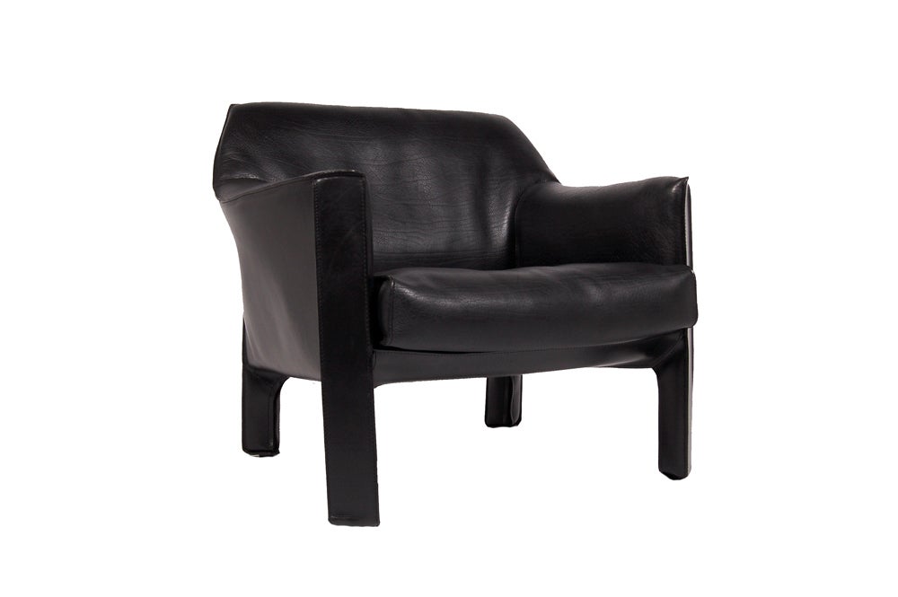 Club chair from the Cab series, wide and low, in black saddle leather.  Great condition. Made by Cassina. This chair has been reduced in price from $3800 to $2650. No further discounts please.