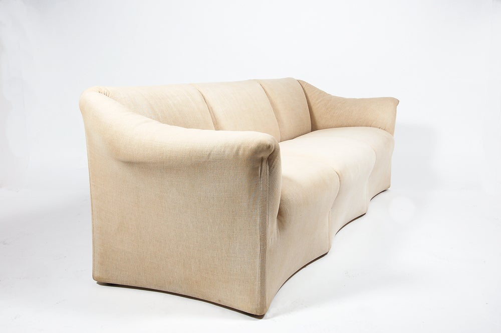 Three seat sofa, covered in natural linen, by B&B Italia; distributed by Atelier International. Retains label. This sofa has been reduced in price from $3500 to $2450. No further reductions please.