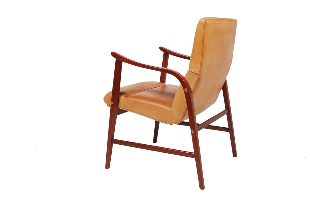 Armchair with mahogany stained beechwood frame and new natural leather upholstery.