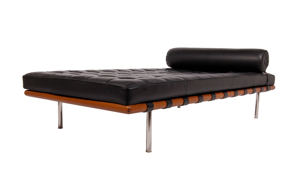 Classic bench by Mies; teak frame with black leather upholstered and tufted mattress with head bolster on steel legs.  Made by Knoll International. Dated 1983 label.