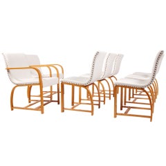 Set of Eight Dining Chairs by Gilbert Rohde