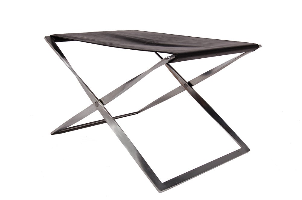 Matte chromed steel folding base with black leather sling seat. Very good original condition. Made by Fritz Hansen. This example from late 1980s.
