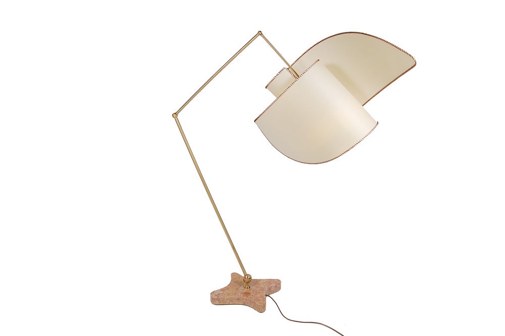 This adjustable floor lamp designed by Mollino in 1947 never went into production due to a fire in his studio. A limited edition was produced in 1994  from surviving documents. Parchment shade supported by adjustable brass arm on polished marble
