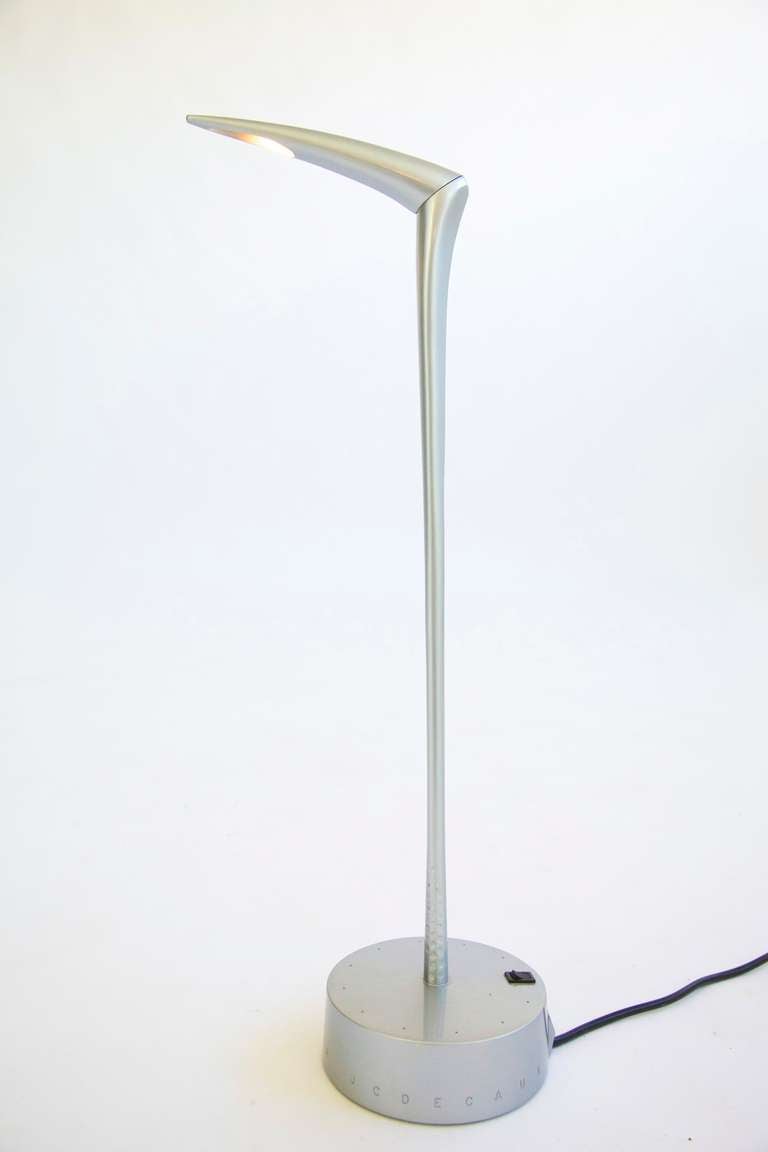 Philippe Starck table lamp for JCDecaux. In 1992, Philippe Starck worked with JCDecaux to develop a revolutionary street lamp, Streetlight, a striking yet functional solution to illuminating the city streets. With its pivoting head rotating from the