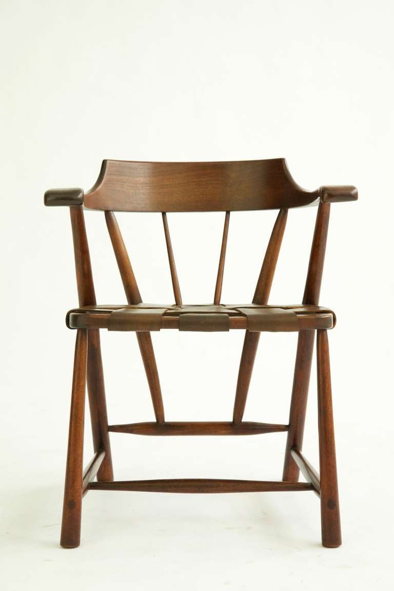 Esherick Stuidio hand crafted classic captains chair, walnut and saddle leather.  These chairs are extremely rare.