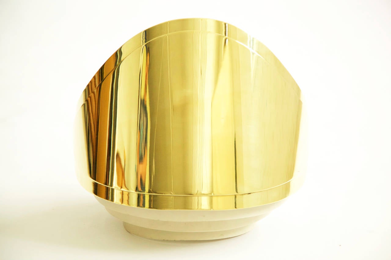 Warren Platner Associates architects: Custom sconces for European commission. Mirrored polished brass shield with three steel louvers for diffused dramatic effect.