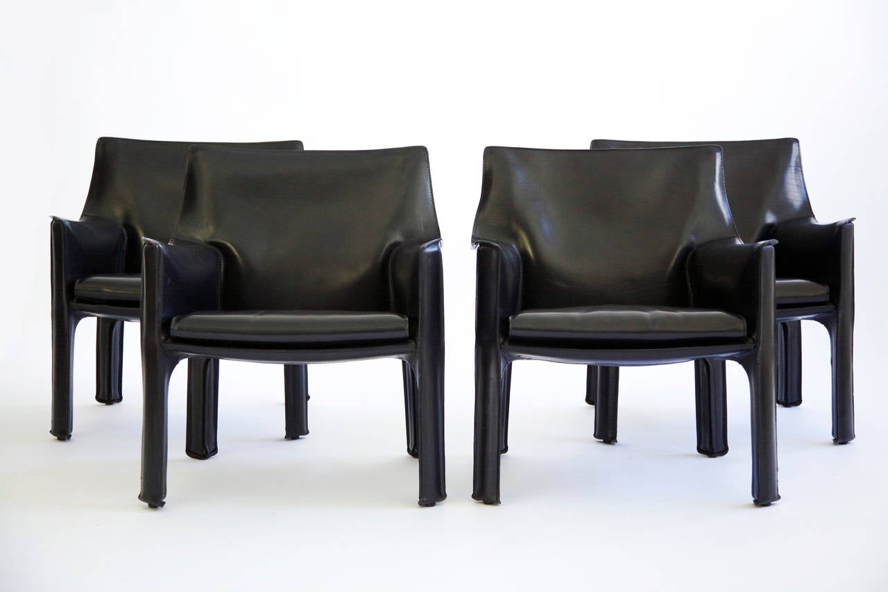 Bellini for Cassina Cab lounge chairs model 414 in Nero belting leather.