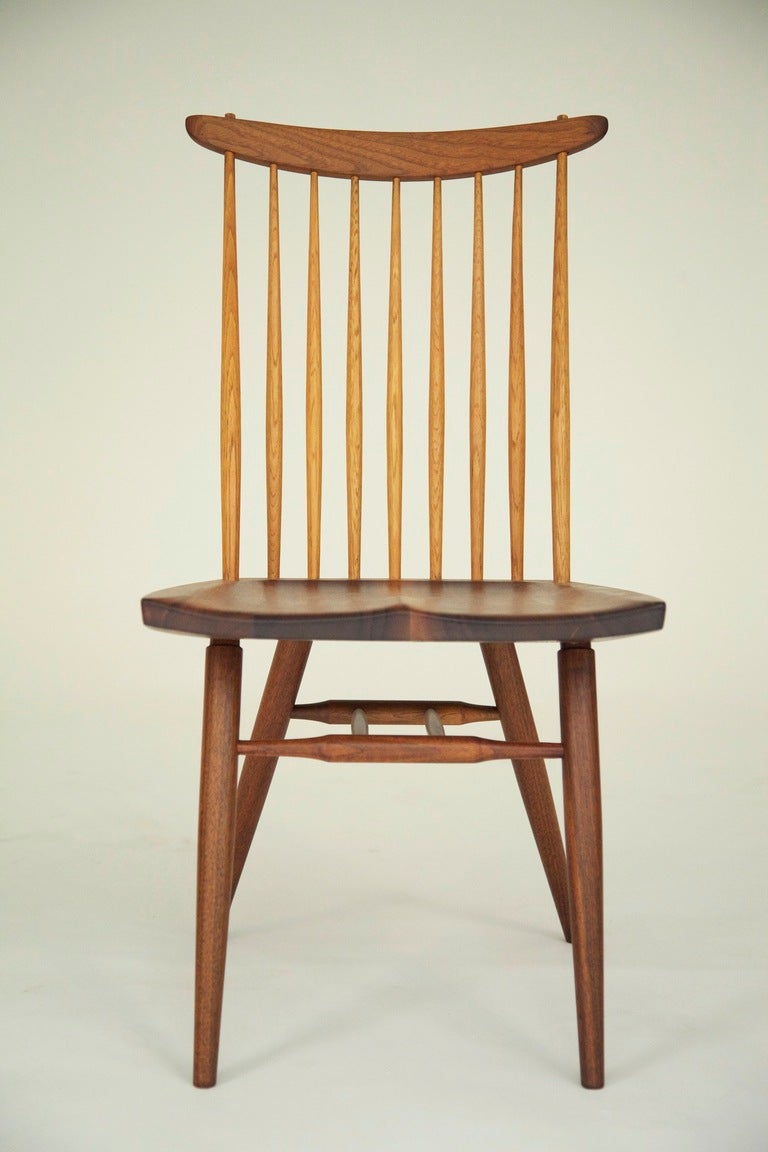 George Nakashima Eight dining chairs 
Original George Nakashima Studio.
Seat crest rail and legs walnut, spindles hickory.
Letter of authenticity from Nakashima provided.  