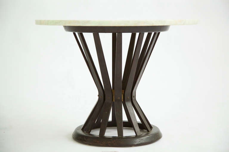 Wormley for Dunbar Occasional Table, steam bent mahogany wood forms corset detail with brass ring and onyx top.
Retains original brass label [Dunbar Berne Indiana]