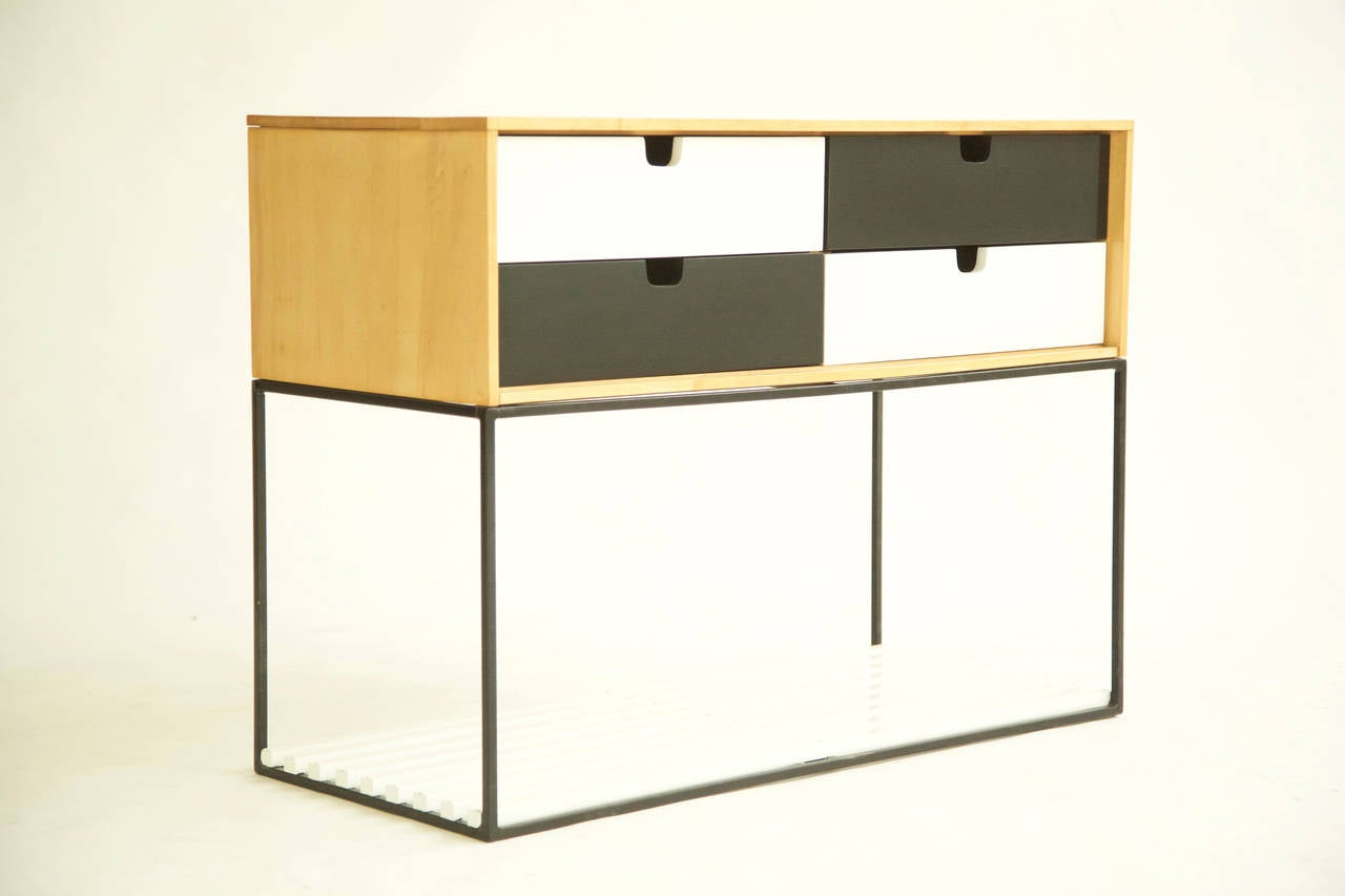 Baughman for Murray, display cabinet, four-drawer case with notched cutout pulls, tubular iron frame support with wooden slats.