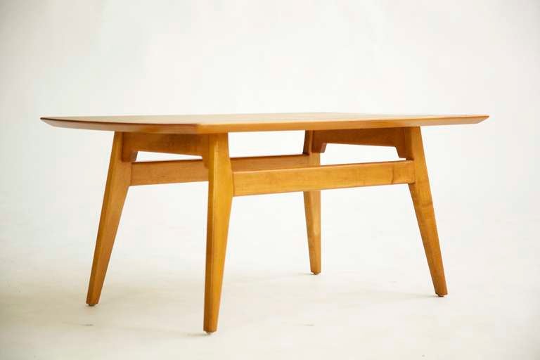 Risom for Risom Inc. Coffee table. Bow shaped ends with architectural splayed base.
