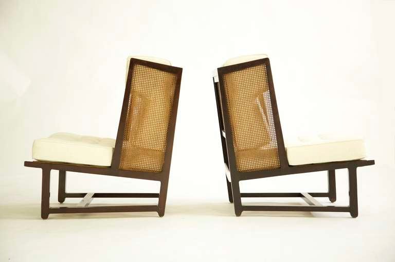 Edward Wormley for Dunbar, Rare pair of Snug Wingback Lounges.
Model 6016 mahogany wood, caning and upholstery.