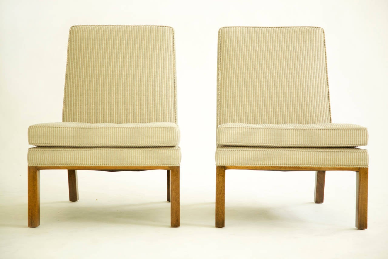 Probber for Probber Inc. Pair of Lounges, upholstered with Great Plains raised stripped cotton blend, white and cream fabric. Mahogany wood window pane backs with solid mahogany legs and tufted seats.